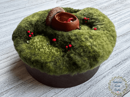 One-of-a-kind 3-inch micro-embroidery featuring a hand-carved acorn surrounded by embroidered moss, British soldier and fairy cup lichens, and tiny woodland details, framed in warm handmade walnut wood frame.